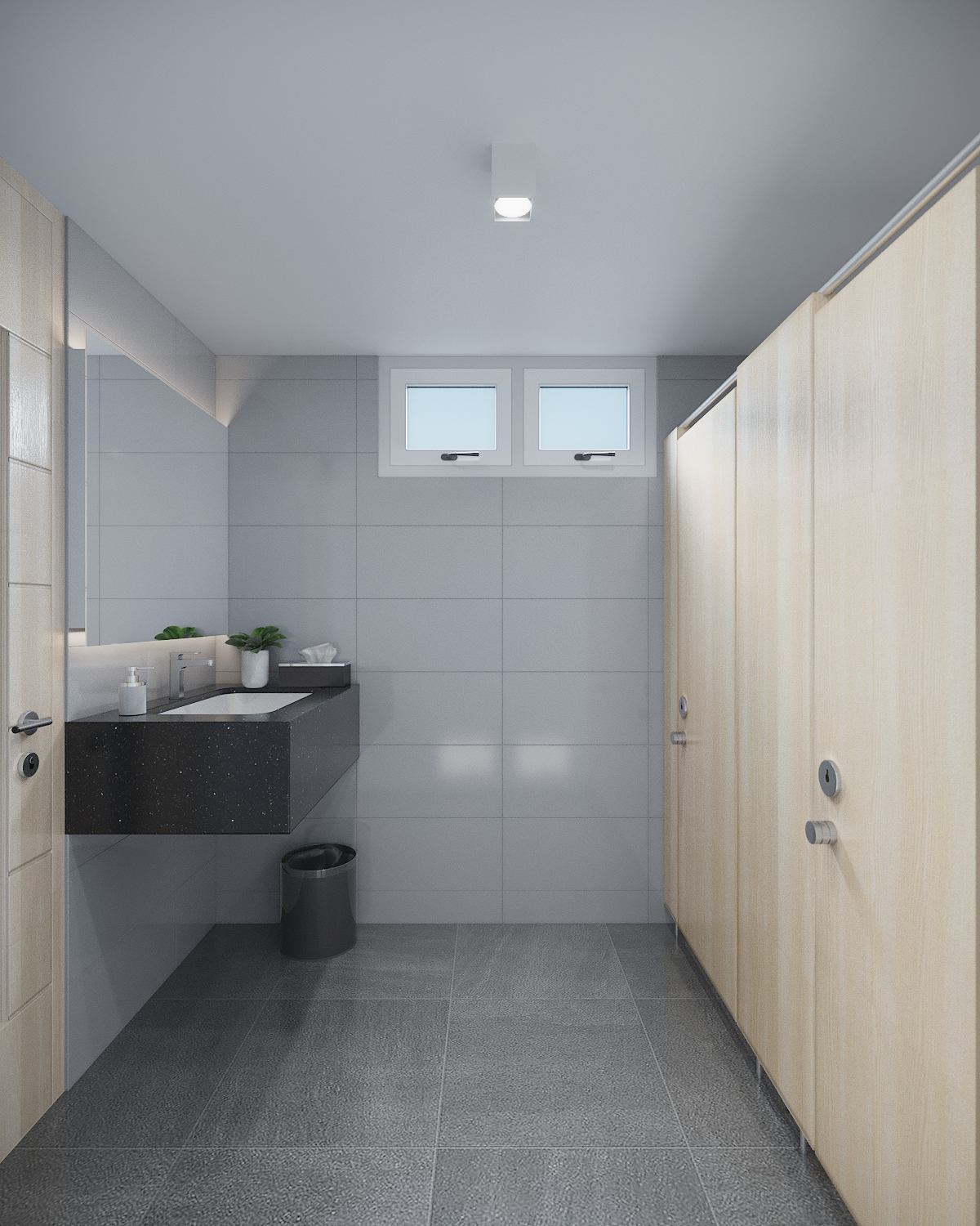 Ground-floor washroom in stone and timber finishes at Romrawin head office