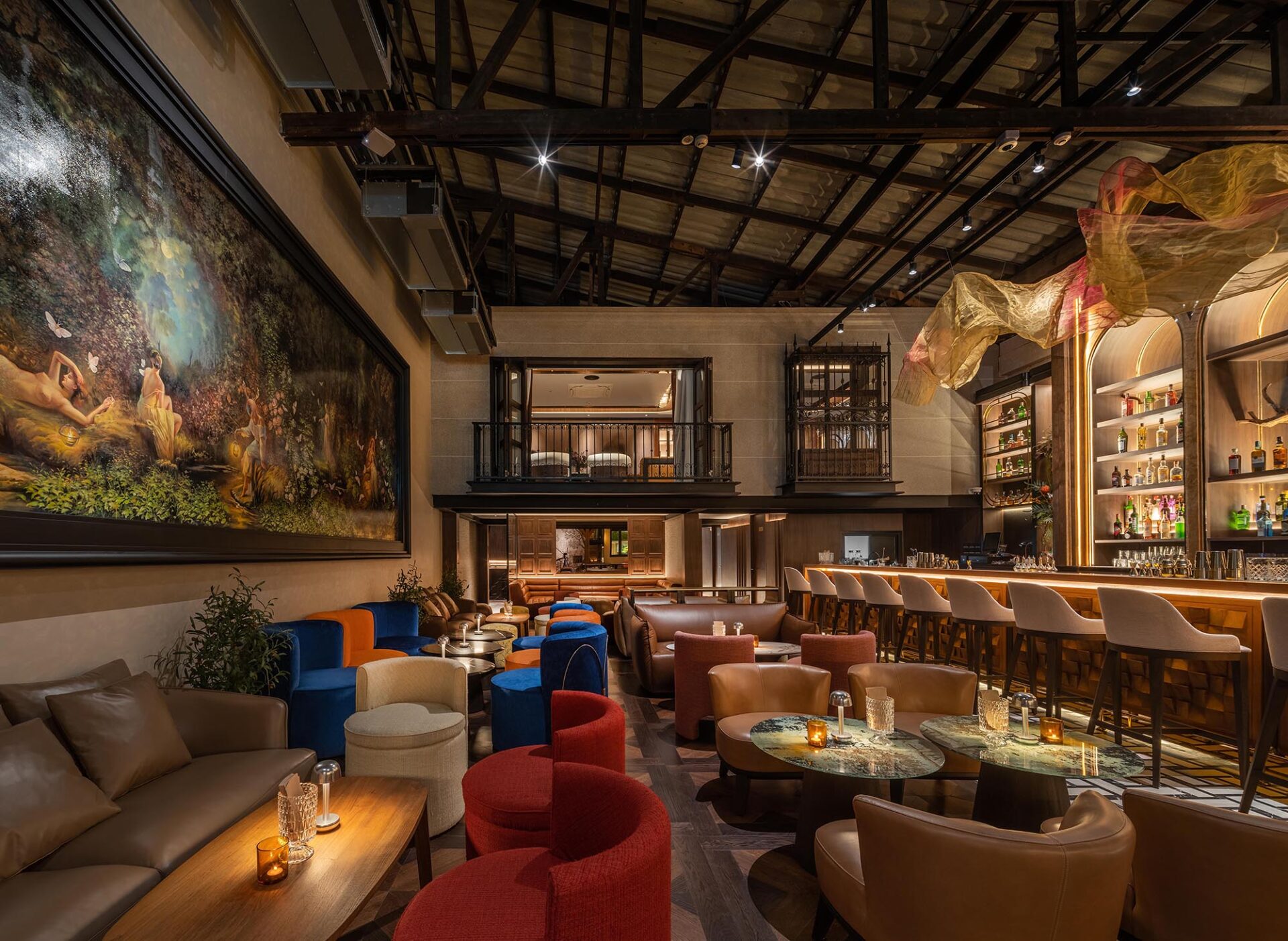 Kilik Social Club Bangkok — warehouse bar interior with exposed steel trusses, arched back bar and colourful lounge seating by Gratitude Design