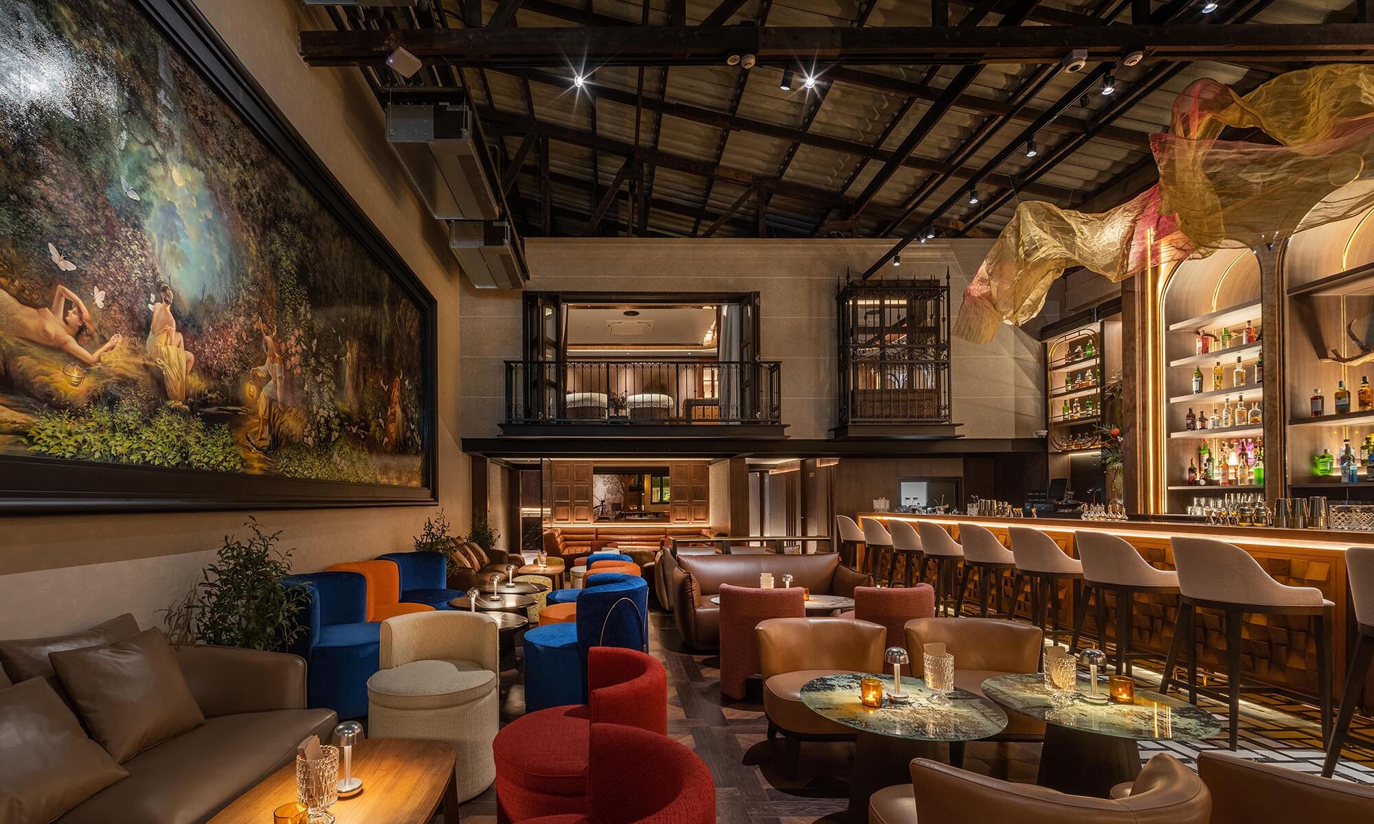 Kilik Social Club Bangkok — warehouse bar interior with exposed steel trusses, arched back bar and colourful lounge seating by Gratitude Design