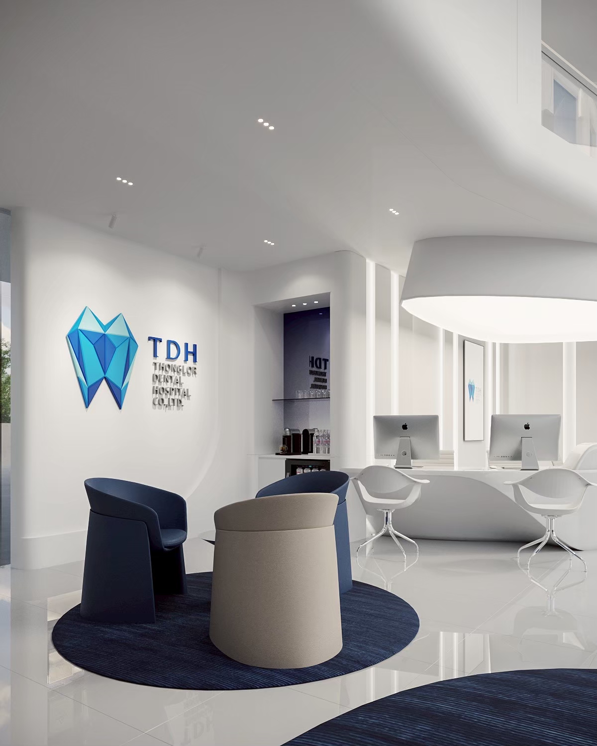 Dental hospital reception with navy lounge chairs and consultation desks
