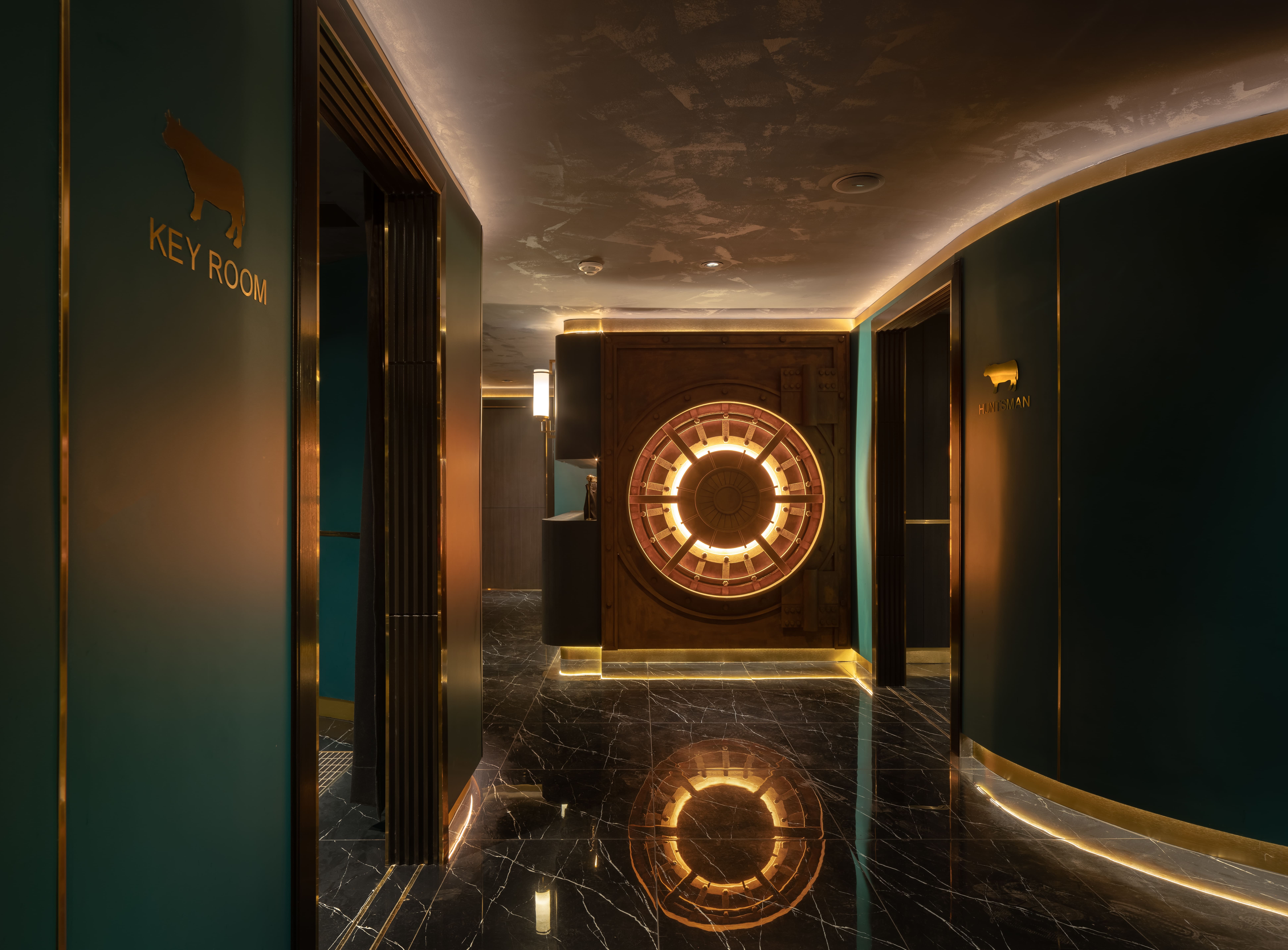 Corridor to the private rooms with a lit ring set into the wall and mirrored in the floor