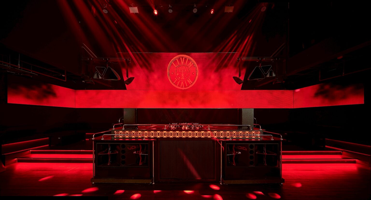 MU:IN Bangkok nightclub interior design — The main bar, set beneath the club’s emblem