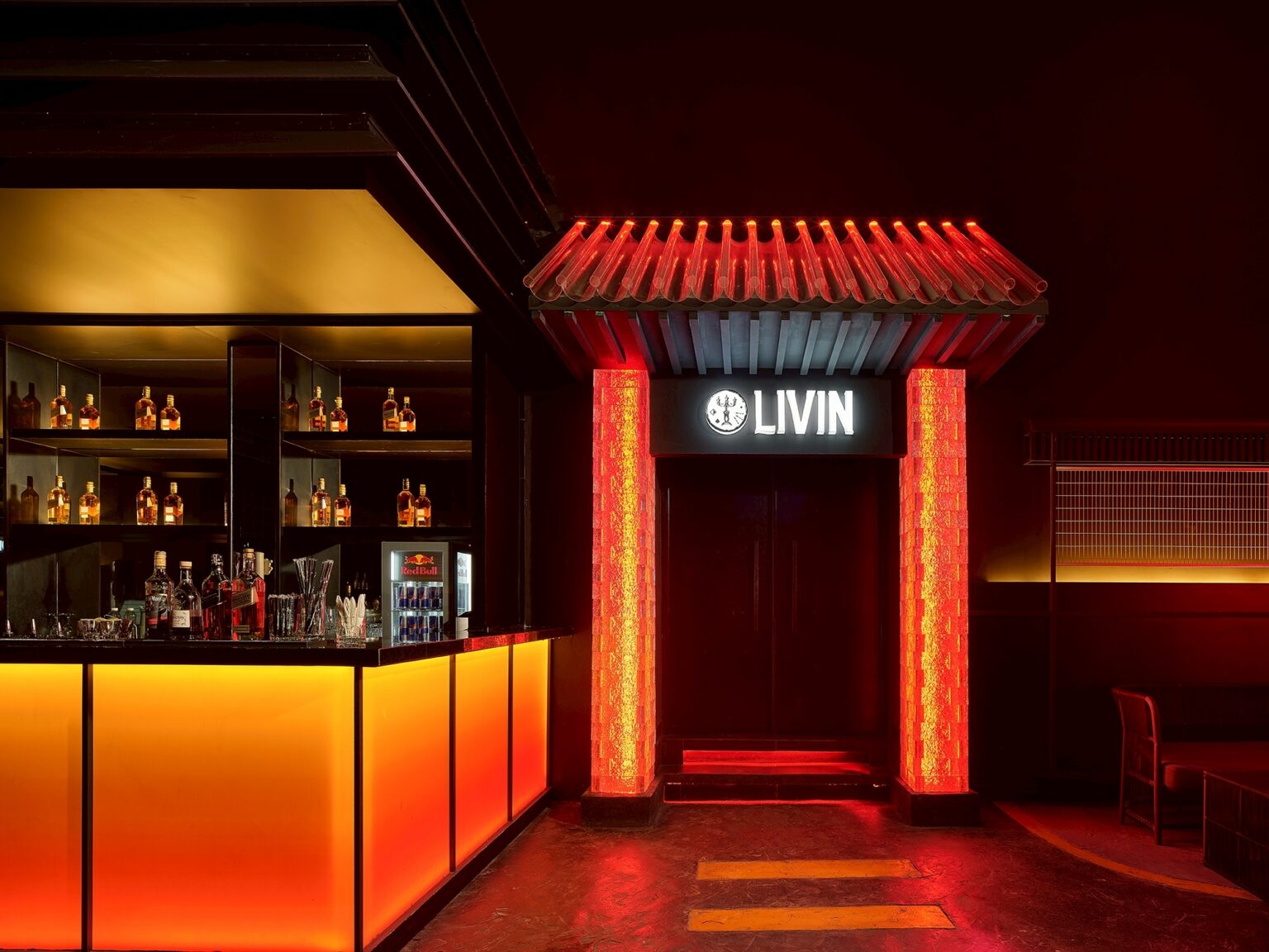 MU:IN Bangkok nightclub interior design — LIVIN — the bar canopy borrows the language of the gate