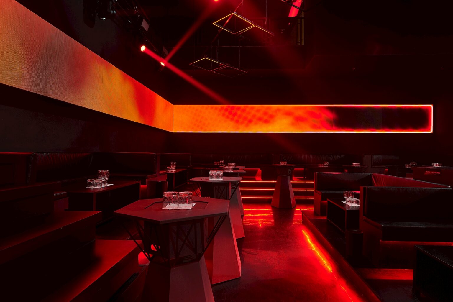 MU:IN Bangkok nightclub interior design — VIP lounge — a quieter register of the same palette