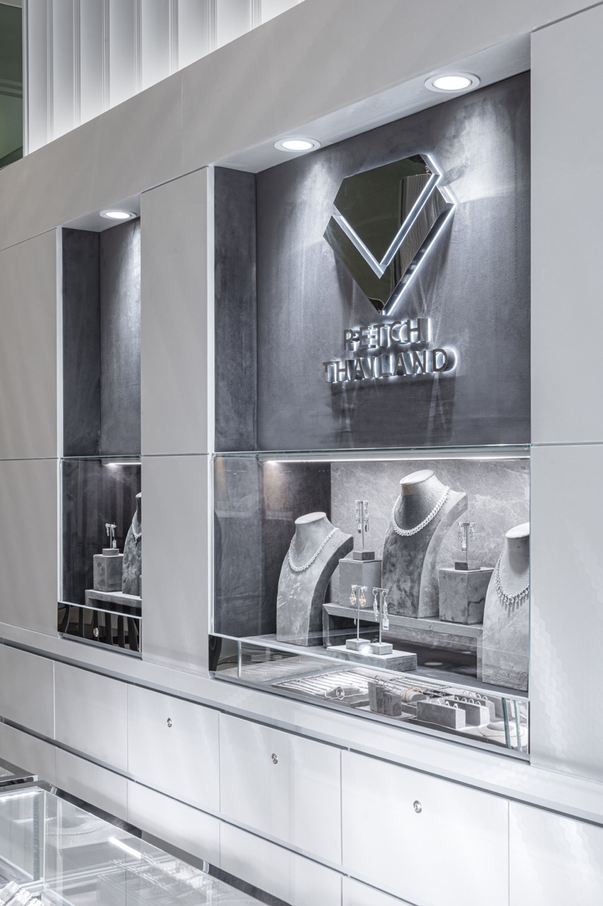 Illuminated display niches and the Petch Thailand diamond emblem, Surawong Road, Bangkok
