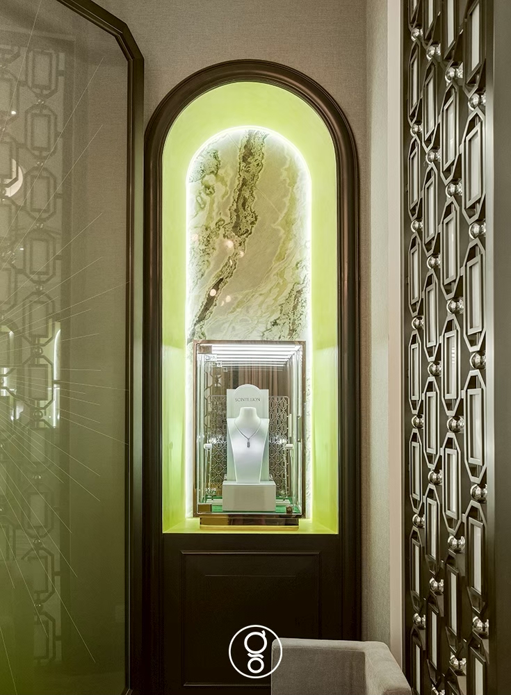 Illuminated display niche with a necklace on green onyx at Scintillion, Bangkok
