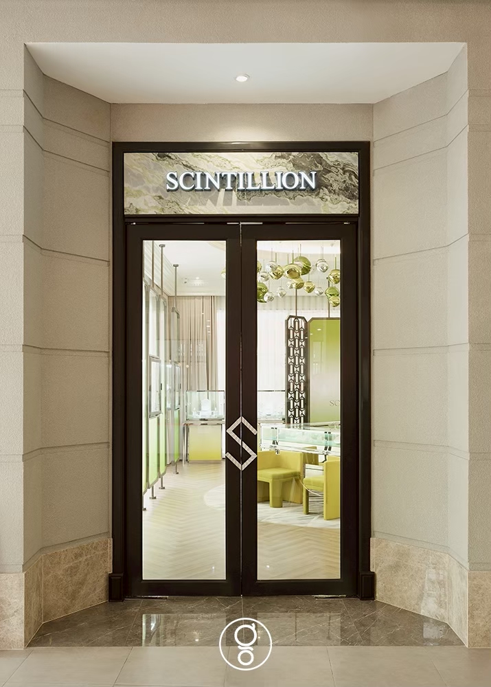 Glazed entrance doors of Scintillion on Surawongse Road seen on approach