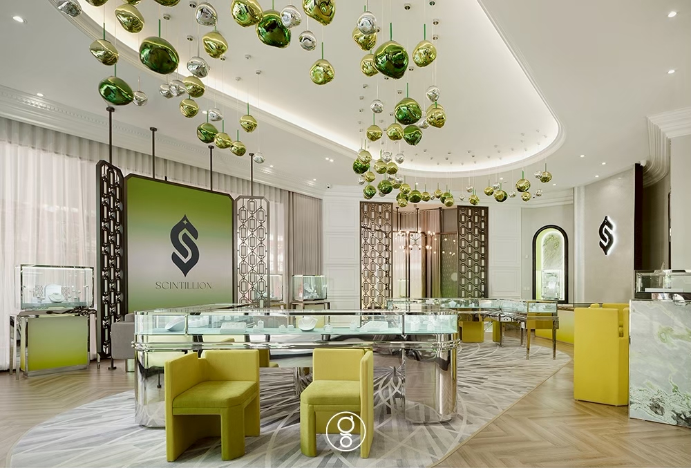 Open retail floor with display counters and the Scintillion monogram wall