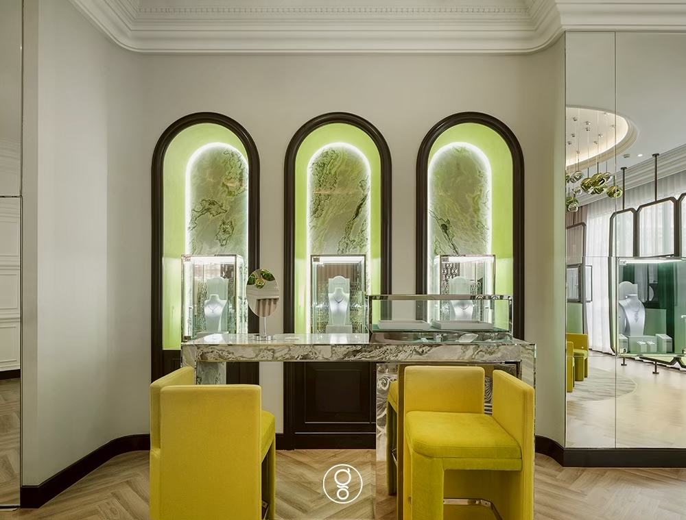 Arched backlit onyx niches and consultation table at Scintillion, Bangkok
