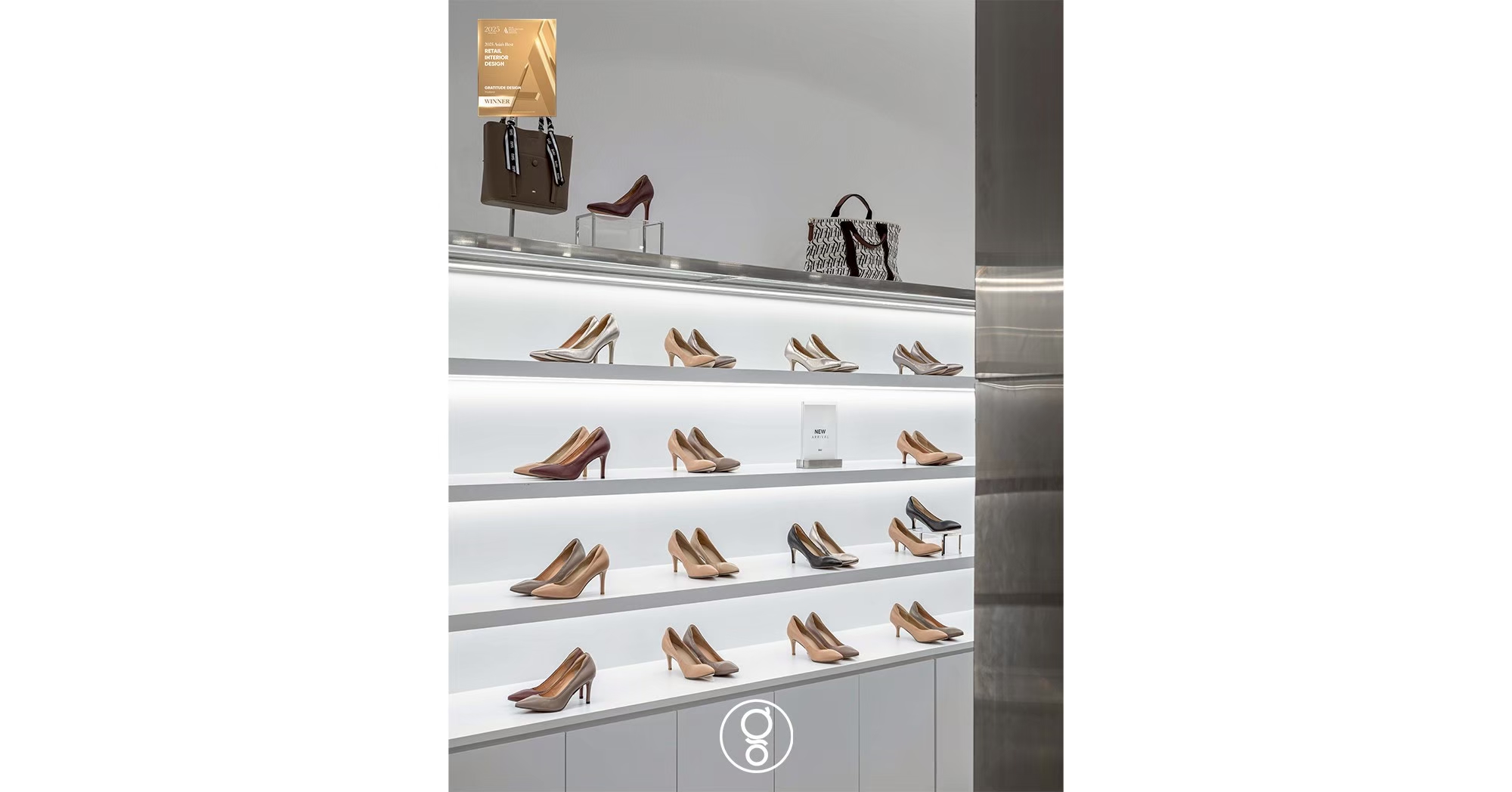 Detail of backlit shelving in the SHU store with court shoes and handbags on an illuminated white ledge