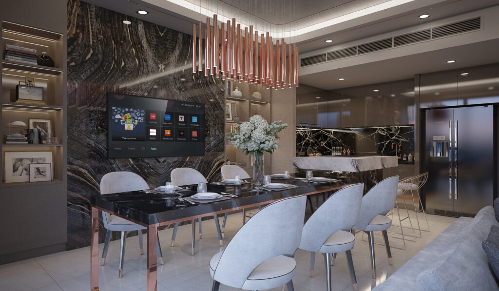 Open living, dining and kitchen at The Bangkok Sathorn unified by a run of dark book-matched marble, interior design by Gratitude Design