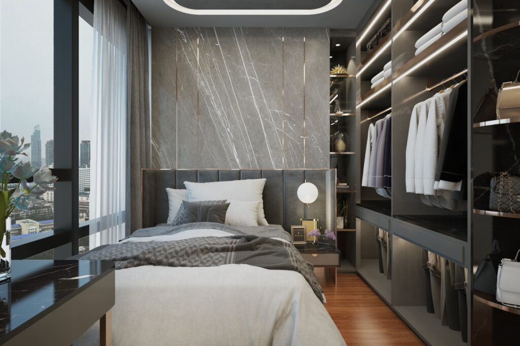 Master bedroom with book-matched marble at The Bangkok Sathorn condominium by Gratitude Design