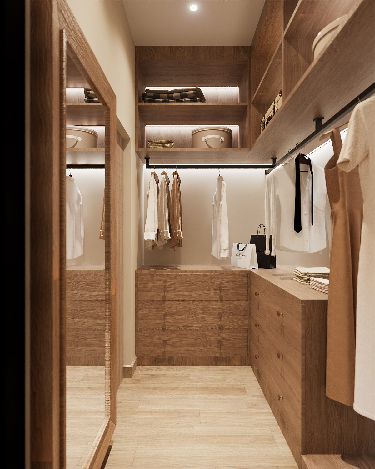 Baan Petchkasem walk-in wardrobe — oak drawers and lit shelving with a black hanging rail and a full-height timber-framed mirror