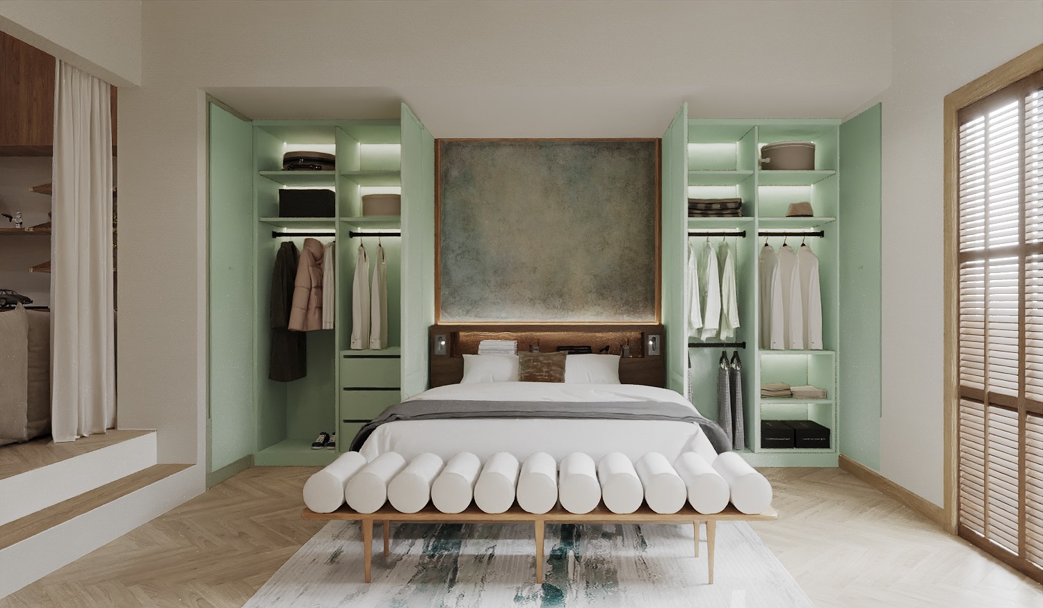 Baan Petchkasem bedroom — a bed between open mint green wardrobes with internal lighting, a textured panel above the headboard and a white bolster bench