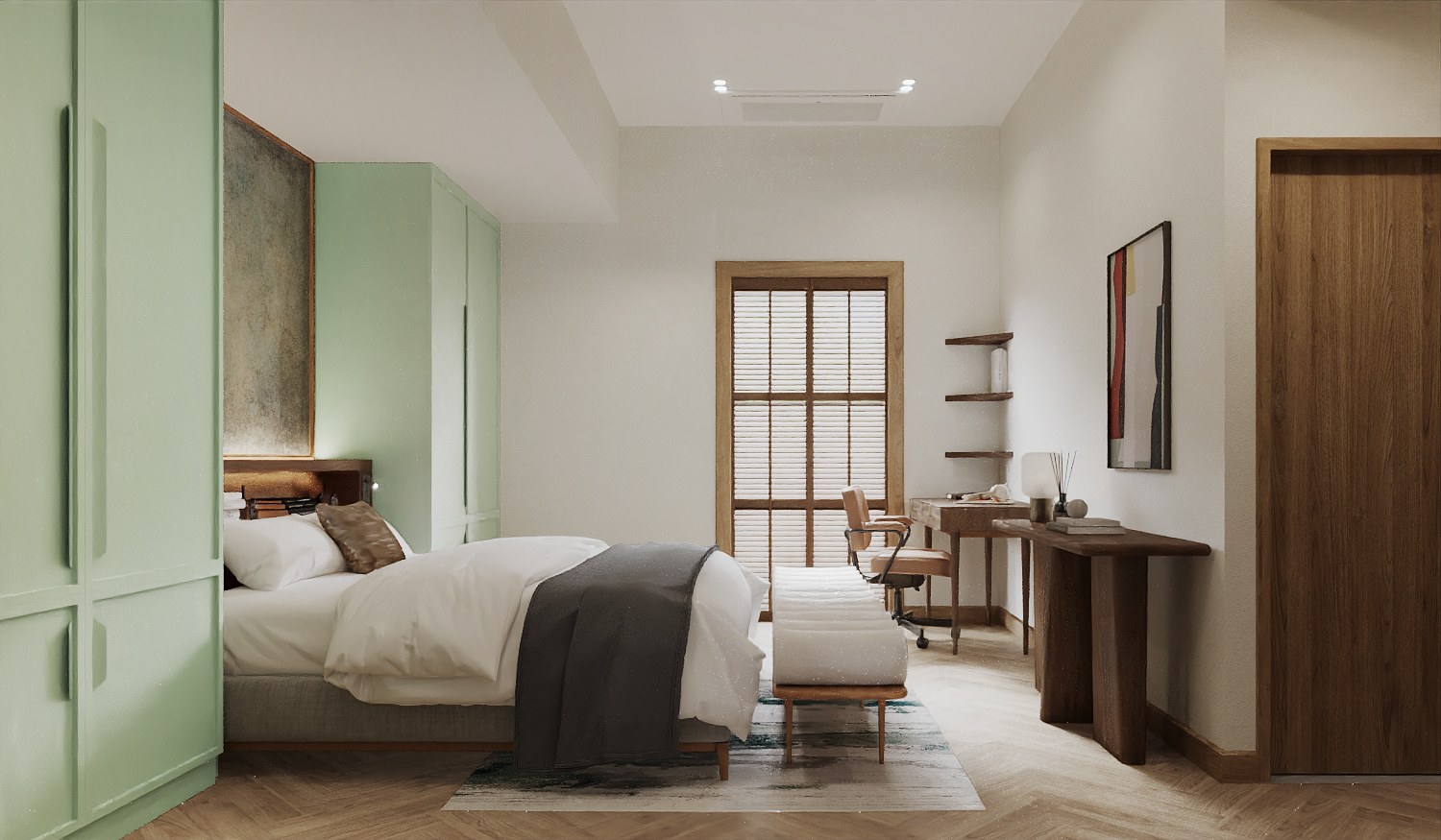 Baan Petchkasem bedroom seen from the side — mint green wardrobes, a white bed with a grey throw, a timber-shuttered window, a desk and a dark timber console