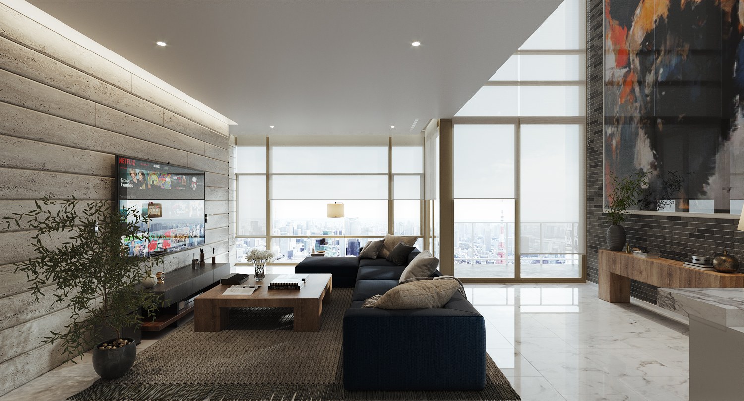 Four Seasons Residences Bangkok duplex living room — a deep blue modular sofa and timber coffee table on a woven rug, facing a television on a stone-textured wall with concealed lighting, full-height windows beyond