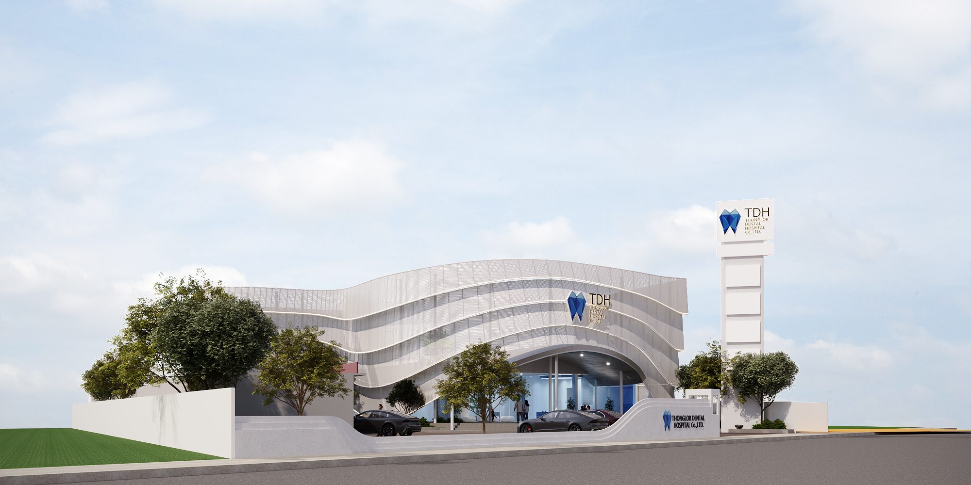 TDH Krungthepkreetha — street elevation with the curved perforated façade, landscaped boundary wall and signage pylon