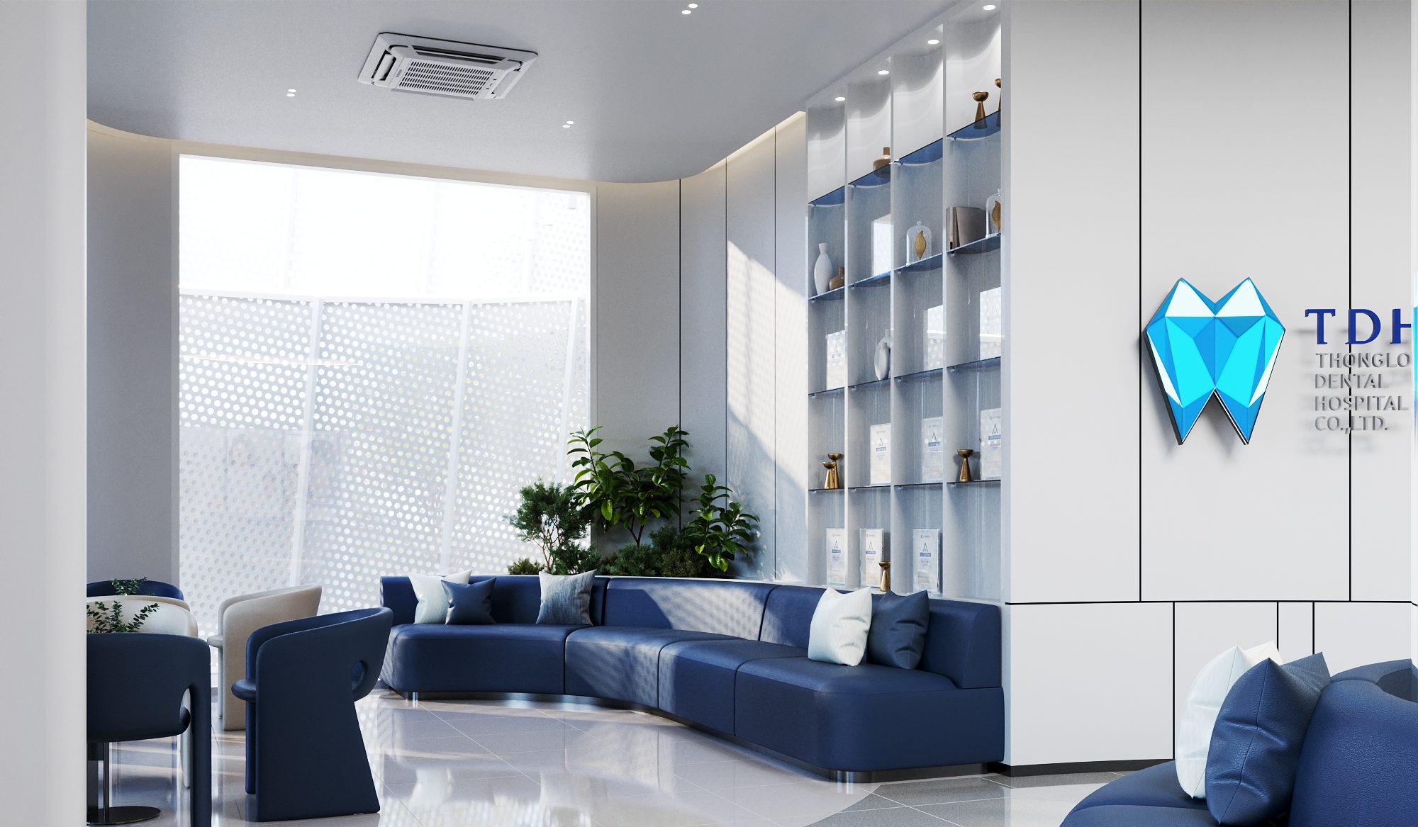 TDH Krungthepkreetha — waiting lounge with a long curved blue sofa, planting and the perforated façade screen beyond