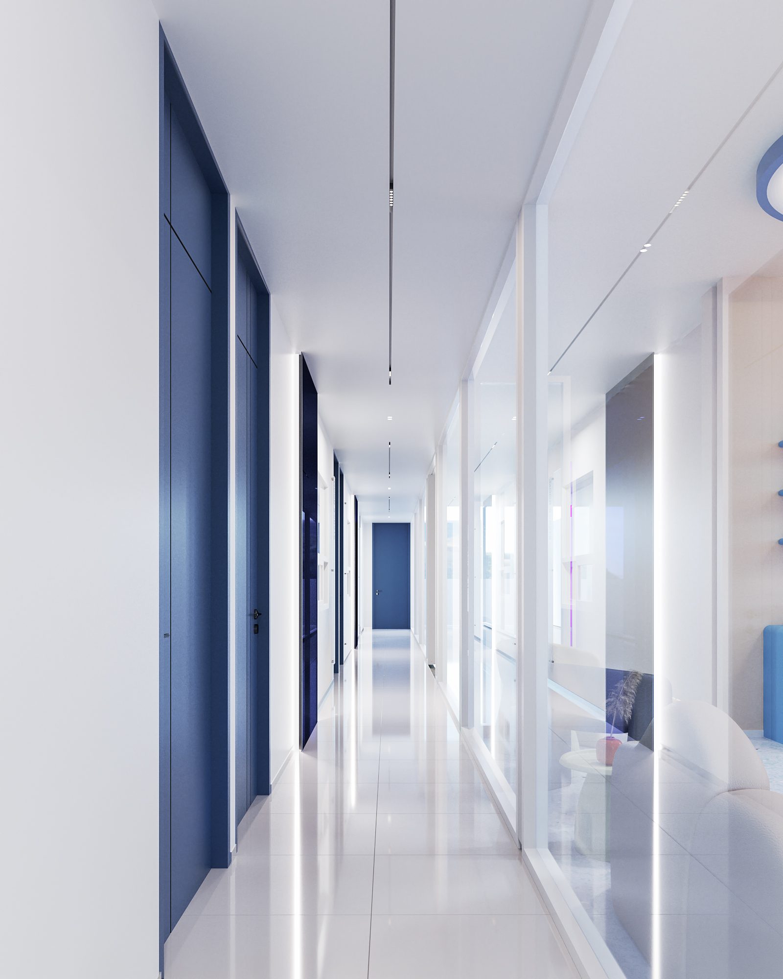 TDH Krungthepkreetha — corridor of deep-blue doors with linear lighting and glazing to the children’s area